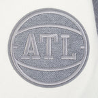 NBA ATLANTA HAWKS REVERSE FRENCH TERRY BLOUSON COLLÉGIAL EN LAINE À BLOCS DE COULEUR POUR HOMME (NOIR/GRIS/COQUILLE D'ŒUF)