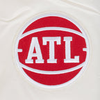 NBA ATLANTA HAWKS RETRO CLASSIC BLOUSON EN SATIN À BORDS CÔTELÉS POUR FEMME (COQUILLE D'ŒUF/ROUGE)