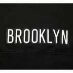 NBA BROOKLYN NETS CLASSIC CHANDAIL À CAPUCHON EN MOLLETON À GLISSIÈRE POUR FILLE JUNIOR (NOIR)