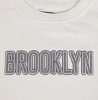 NBA BROOKLYN NETS REVERSE FRENCH TERRY WOMEN'S FLEECE CREWNECK (EGGSHELL)