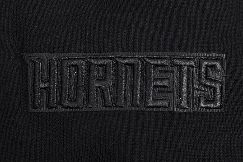 NBA CHARLOTTE HORNETS NEUTRAL CHANDAIL À CAPUCHON À ÉPAULES TOMBANTES POUR HOMME (NOIR)