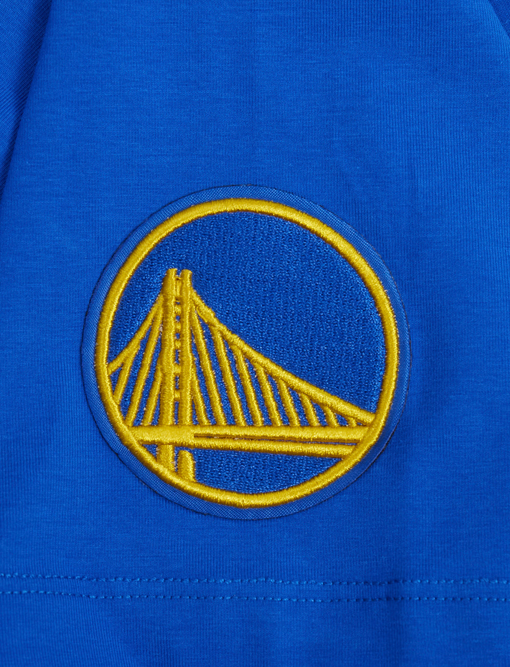 NBA GOLDEN STATE WARRIORS SCRIPT TAIL WOMEN'S SINGLE JERSEY BOXY TEE (ROYAL BLUE)