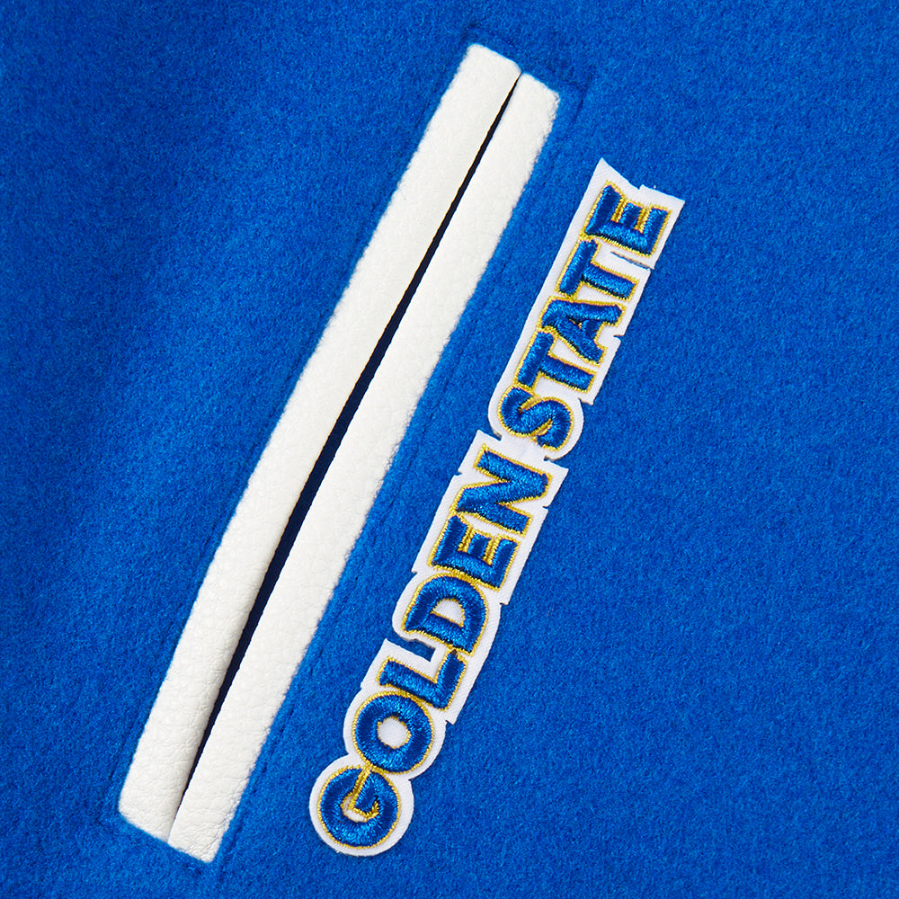 NBA GOLDEN STATE WARRIORS CLASSIC STUDIO BLOUSON COLLÉGIAL POUR GARÇON JUNIOR (BLEU ROYAL/BLANC)