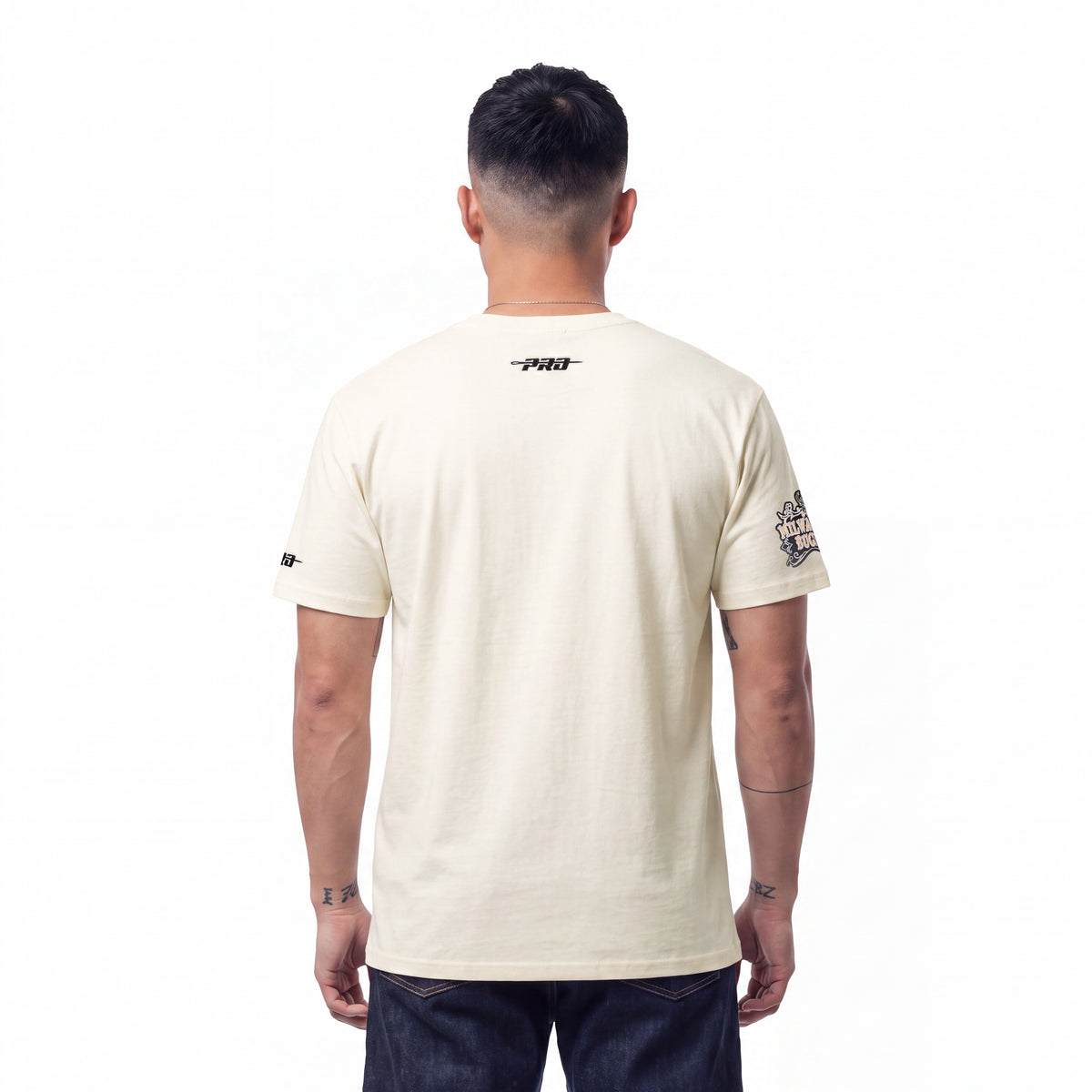 NBA MILWAUKEE BUCKS REBEL ATHLETICS STACKED LOGO MEN'S SJ TEE (EGGSHELL)