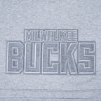 NBA MILWAUKEE BUCKS REVERSE FRENCH TERRY WOMEN'S SINGLE JERSEY BOXY TEE (DARK HEATHER GRAY)