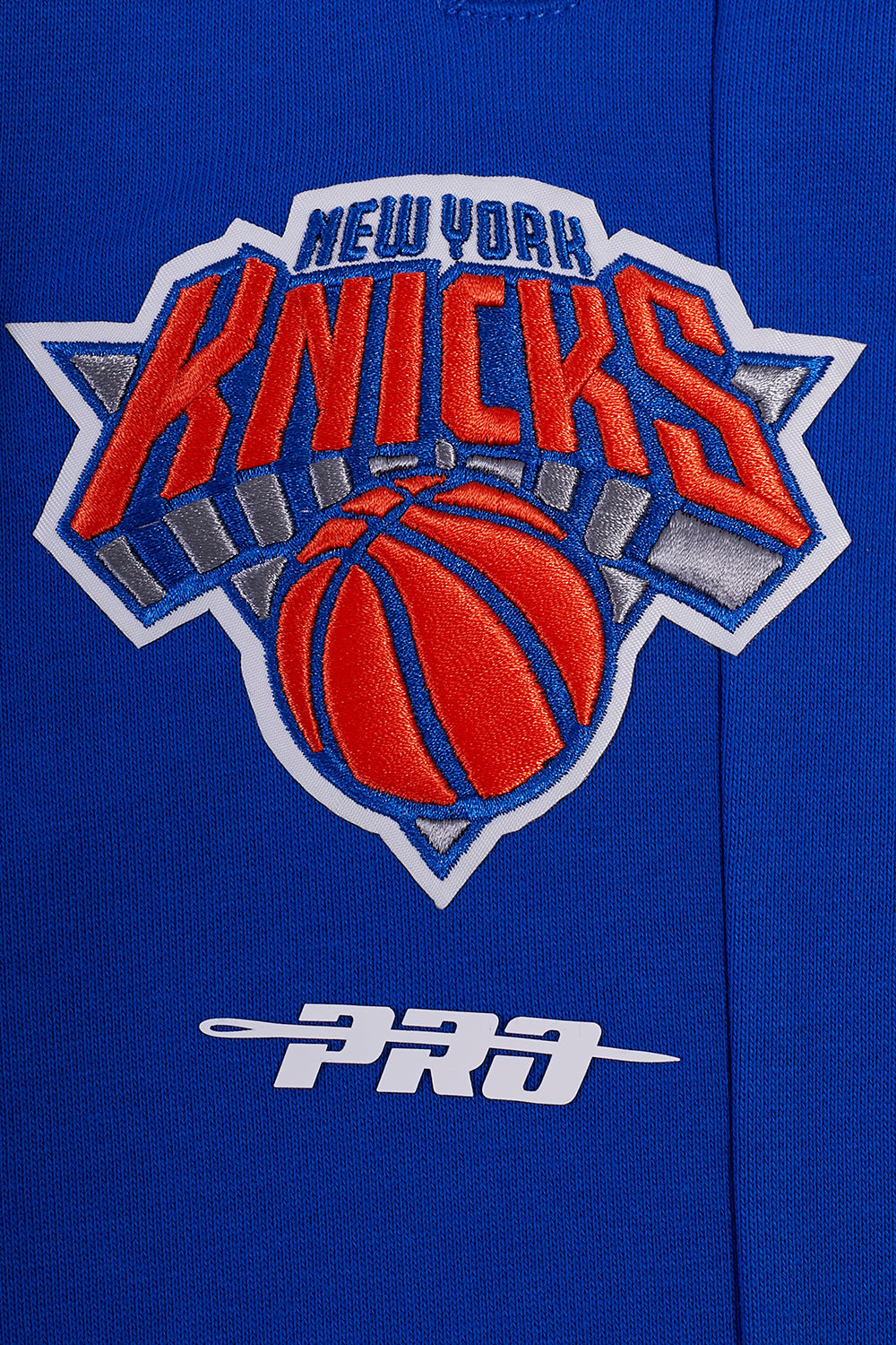 NBA NEW YORK KNICKS SCRIPT TAIL PANTALON OUATÉ EN MOLLETON CÔTELÉ POUR HOMME (BLEU ROYAL/ORANGE/BLEU ROYAL)