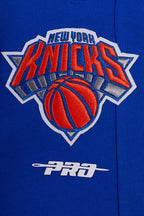 NBA NEW YORK KNICKS SCRIPT TAIL PANTALON OUATÉ EN MOLLETON CÔTELÉ POUR HOMME (BLEU ROYAL/ORANGE/BLEU ROYAL)