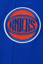 NBA NEW YORK KNICKS SCRIPT TAIL PANTALON OUATÉ EN MOLLETON CÔTELÉ POUR HOMME (BLEU ROYAL/ORANGE/BLEU ROYAL)