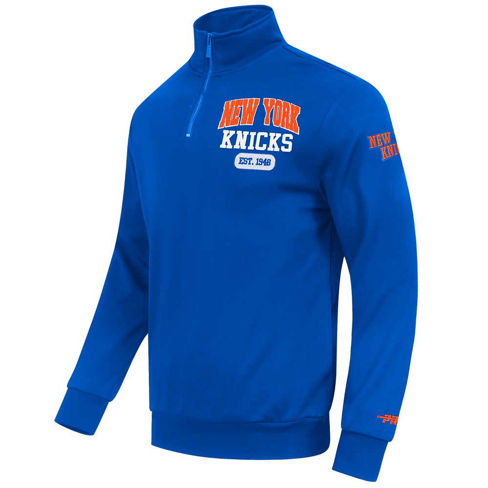 NBA NEW YORK KNICKS CITY ARCH HAUT EN MOLLETON À GLISSIÈRE AU QUART POUR HOMME (BLEU ROYAL)