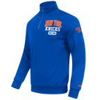 NBA NEW YORK KNICKS CITY ARCH HAUT EN MOLLETON À GLISSIÈRE AU QUART POUR HOMME (BLEU ROYAL)