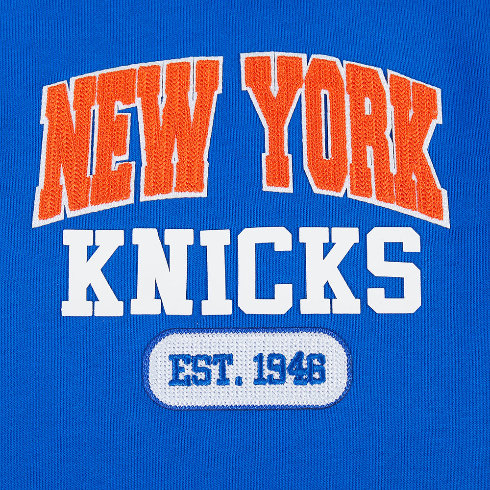 NBA NEW YORK KNICKS CITY ARCH HAUT EN MOLLETON À GLISSIÈRE AU QUART POUR HOMME (BLEU ROYAL)