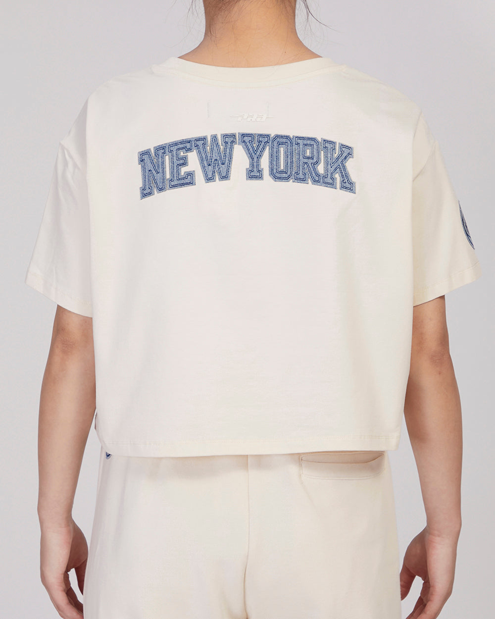 NBA NEW YORK KNICKS VARSITY BLUES WOMEN'S BOXY TEE (LINEN)