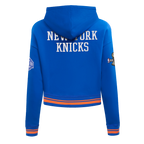 NBA NEW YORK KNICKS CHANDAIL À CAPUCHON DU CHAMPIONNAT 2026 COURT POUR FEMME (BLEU ROYAL/ORANGE/BLEU ROYAL)