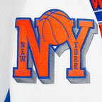 NBA NEW YORK KNICKS RETRO CLASSIC BLOUSON COLLÉGIAL EN LAINE À BORDS CÔTELÉS POUR FEMME (BLEU ROYAL/ORANGE/BLEU ROYAL)