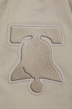 NBA PHILADELPHIA 76ERS NEUTRAL DROP SHOULDER MEN'S TEE (TAUPE)