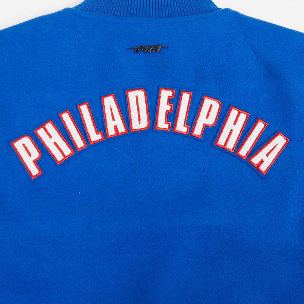NBA PHILADELPHIA 76ERS CLASSIC BLOUSON COLLÉGIAL EN LAINE POUR FEMME (BLEU ROYAL/BLANC)