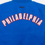 NBA PHILADELPHIA 76ERS CLASSIC BLOUSON COLLÉGIAL EN LAINE POUR FEMME (BLEU ROYAL/BLANC)