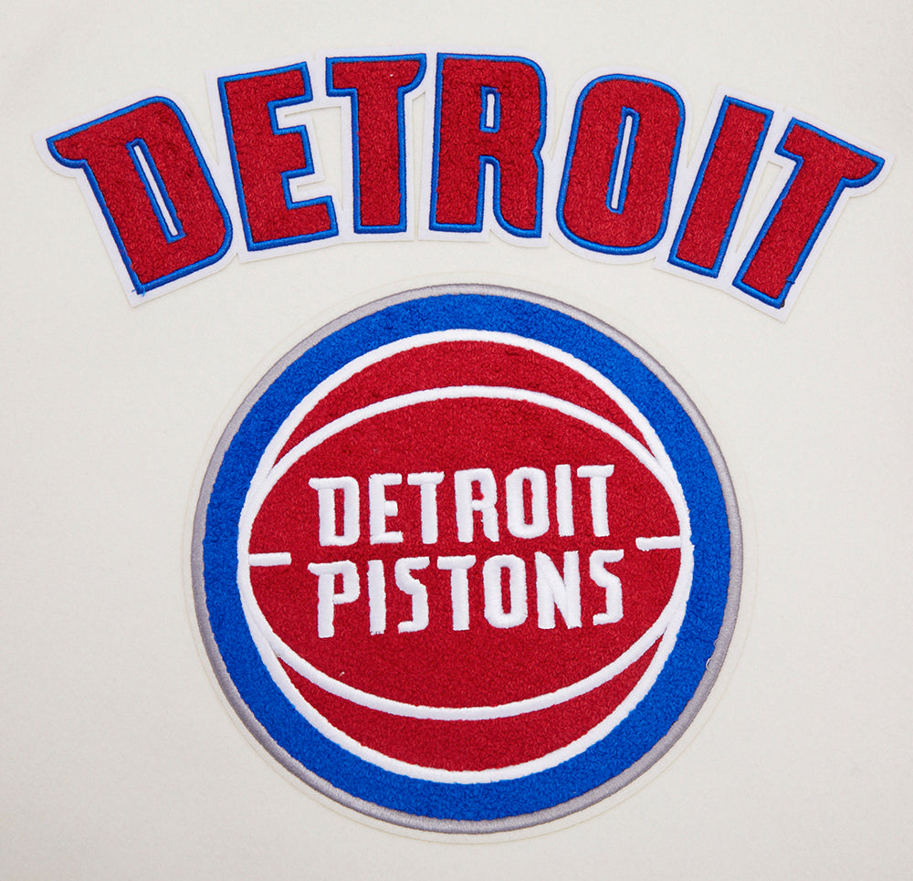 NBA DETROIT PISTONS RETRO CLASSIC BLOUSON COLLÉGIAL EN LAINE À BORDS CÔTELÉS POUR FEMME (COQUILLE D'ŒUF/BLEU ROYAL)