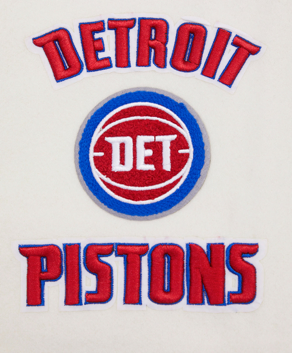 NBA DETROIT PISTONS RETRO CLASSIC BLOUSON COLLÉGIAL EN LAINE À BORDS CÔTELÉS POUR FEMME (COQUILLE D'ŒUF/BLEU ROYAL)