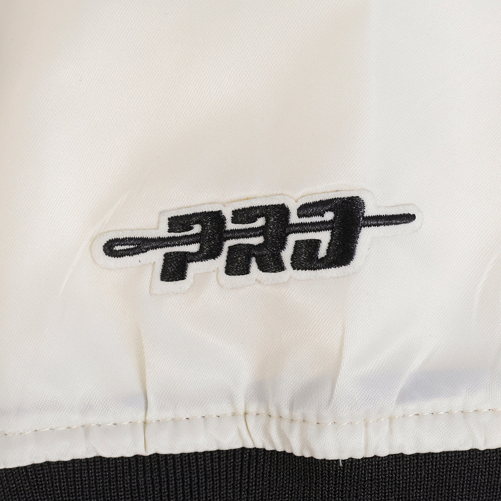 NFL CAROLINA PANTHERS RETRO CLASSIC BLOUSON EN SATIN À BORDS CÔTELÉS POUR FEMME (COQUILLE D'ŒUF/NOIR)