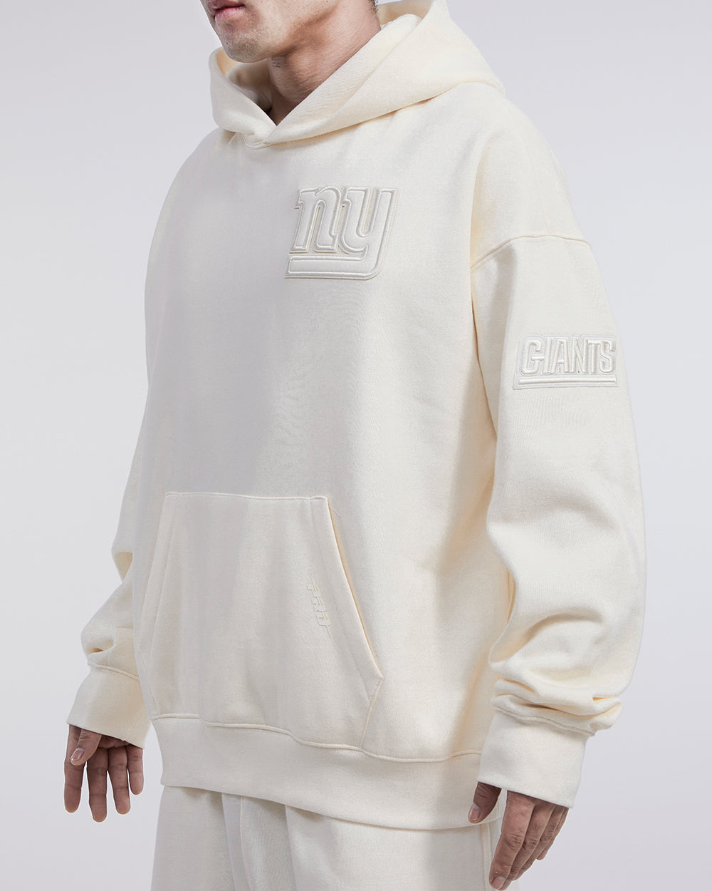 NFL NEW YORK GIANTS NEUTRAL DROP SHOULDER MEN'S PULLOVER HOODIE (EGGSHELL)