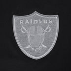 NFL LAS VEGAS RAIDERS REVERSE FRENCH TERRY T-SHIRT EN JERSEY DE COTON À ÉPAULES TOMBANTES POUR HOMME (NOIR)