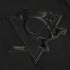 NHL PITTSBURGH PENGUINS NEUTRAL T-SHIRT EN JERSEY DE COTON À ÉPAULES TOMBANTES POUR HOMME (NOIR)