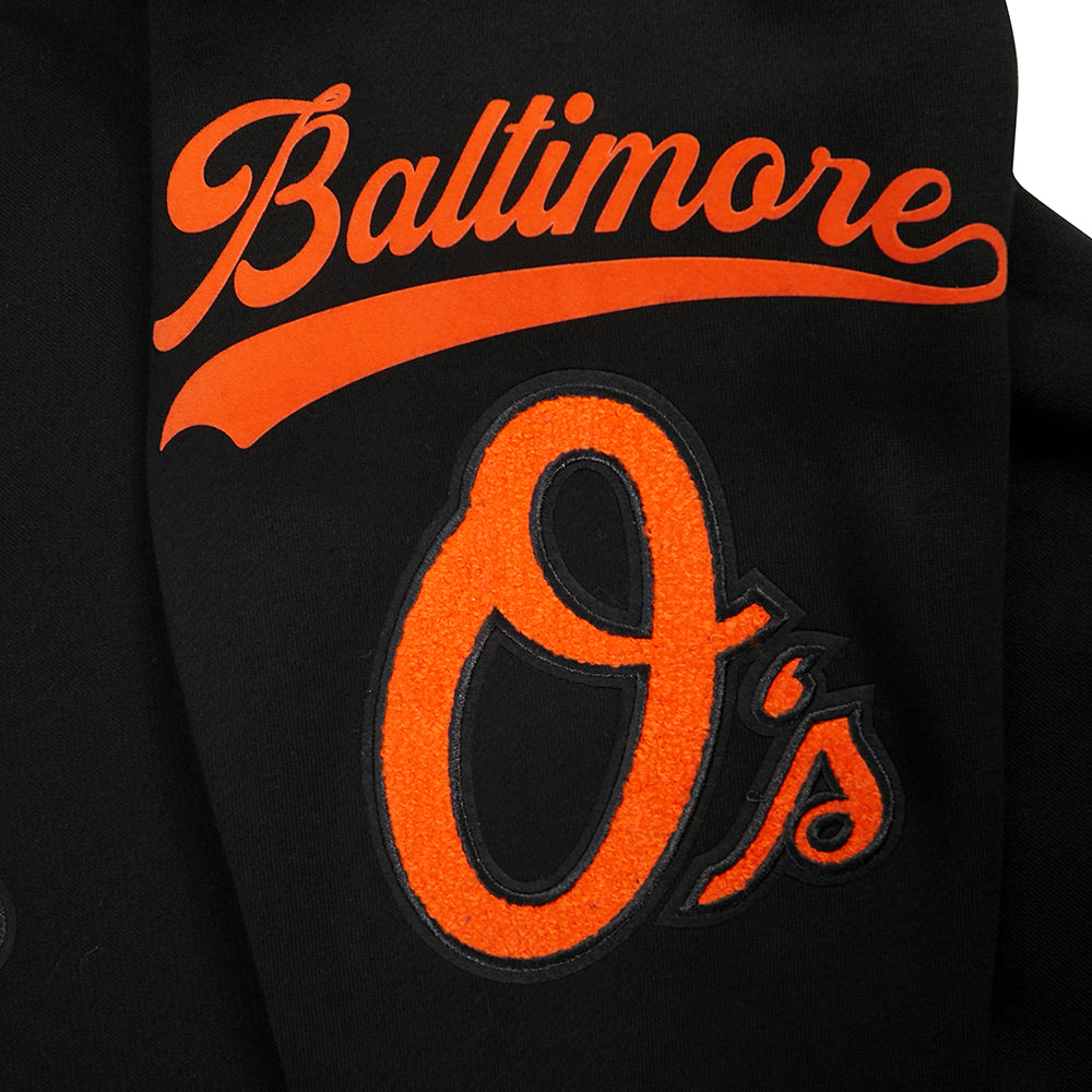 MLB BALTIMORE ORIOLES LIVING LARGE CHANDAIL À CAPUCHON EN MOLLETON À ÉPAULES TOMBANTES POUR HOMME (NOIR)