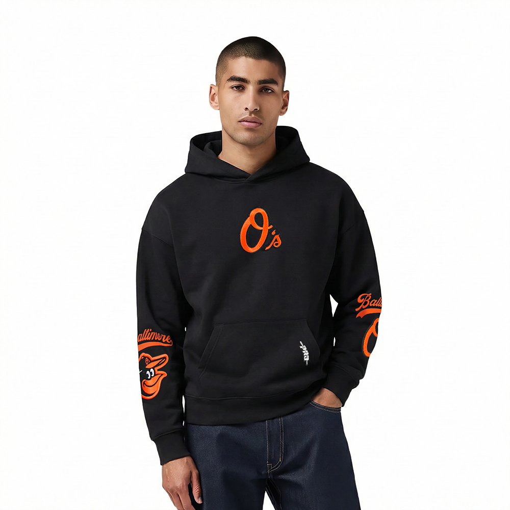 MLB BALTIMORE ORIOLES LIVING LARGE CHANDAIL À CAPUCHON EN MOLLETON À ÉPAULES TOMBANTES POUR HOMME (NOIR)