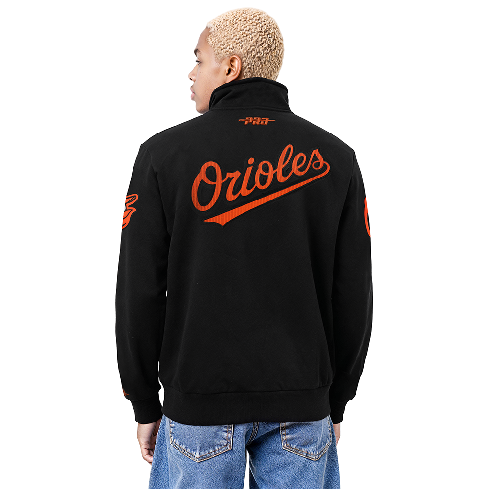 MLB BALTIMORE ORIOLES CITY ARCH HAUT EN MOLLETON À GLISSIÈRE AU QUART POUR HOMME (NOIR)