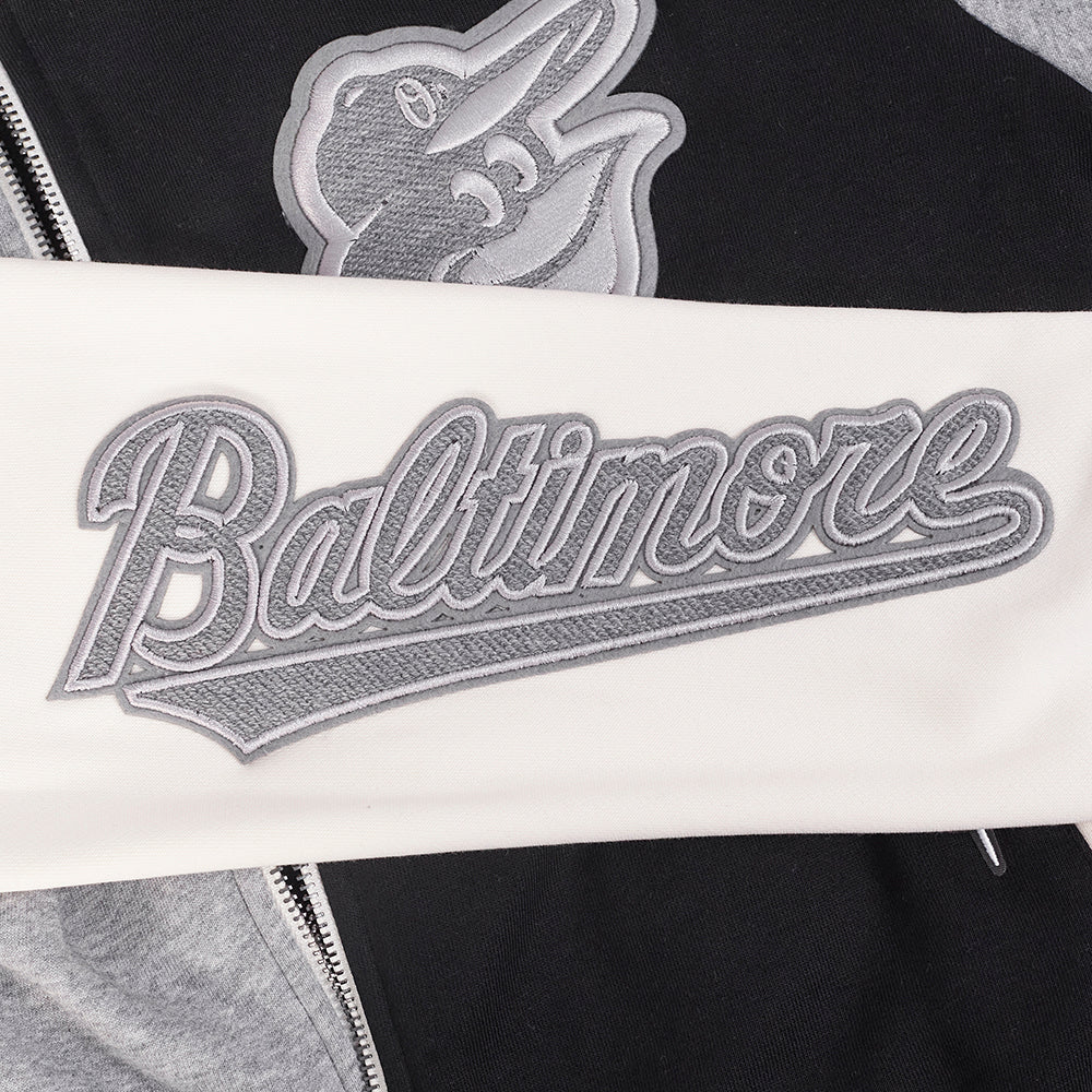 MLB BALTIMORE ORIOLES REVERSE FRENCH TERRY CHANDAIL À CAPUCHON EN MOLLETON À GLISSIÈRE ET À BLOCS DE COULEUR POUR FEMME (NOIR/GRIS/COQUILLE D'ŒUF)